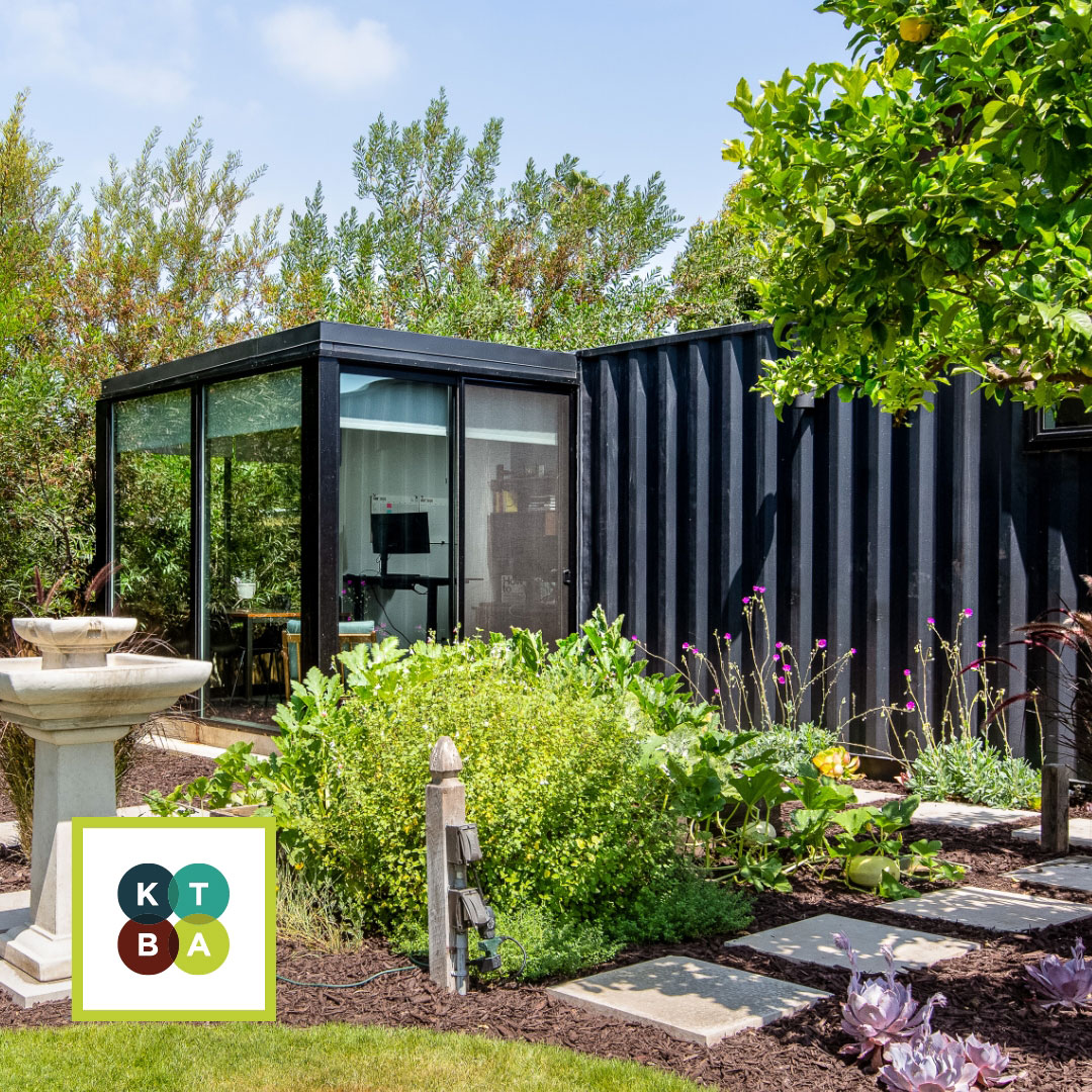 office built out of shipping container in backyard